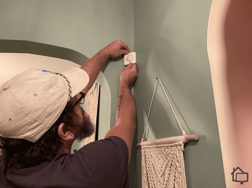 Here I am installing a SimpliSafe motion sensor.